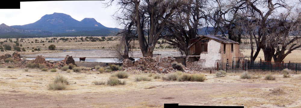 a big old home in ruins and plenty of water.